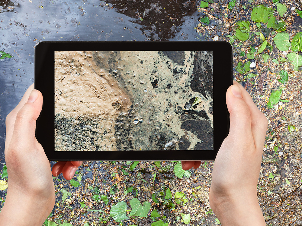 Taking a picture of pollution with tablet