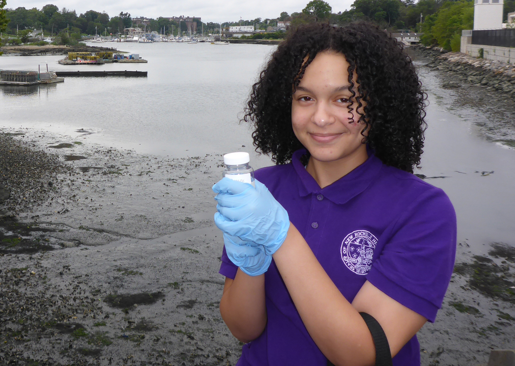 Water Quality volunteer holding sample bottle