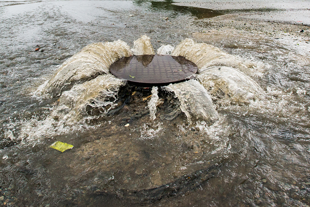 Overflowing sewer manhole