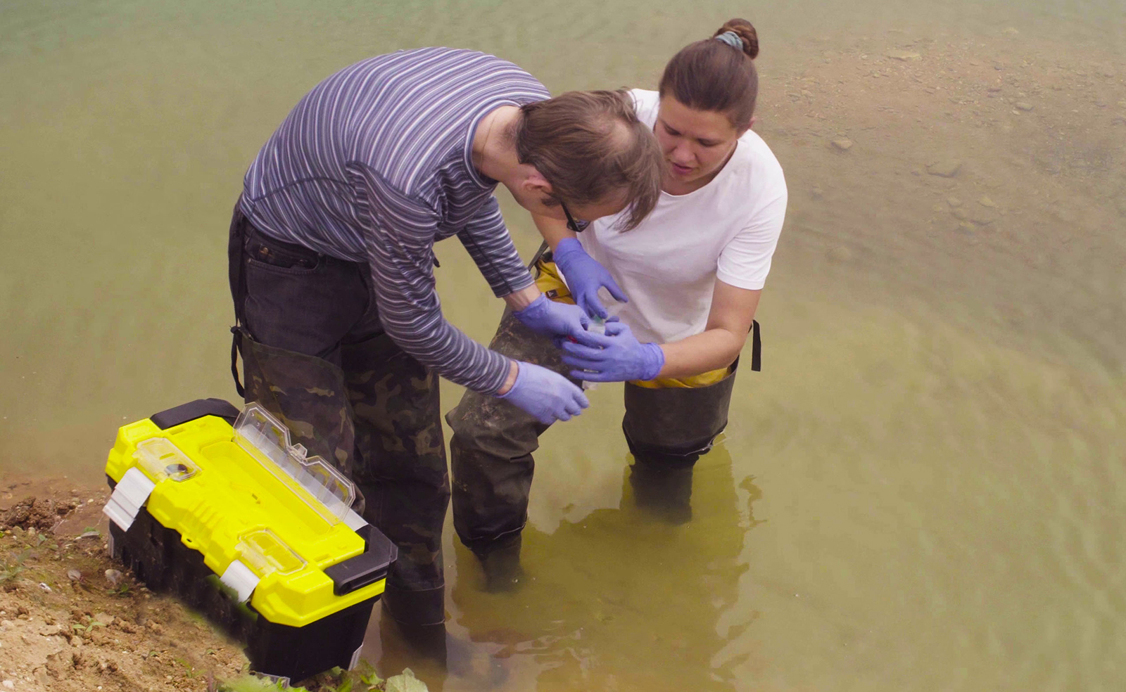 Man and woman collecting water samples