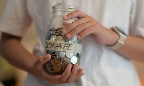 Donation jar full of change